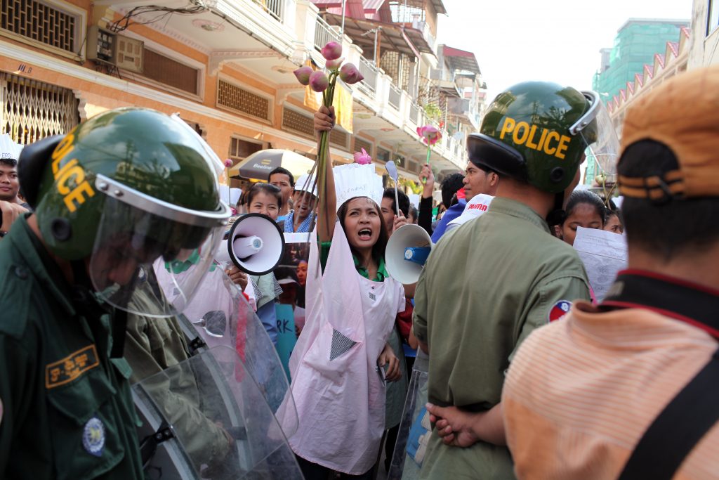 Woman holding flowers in protest