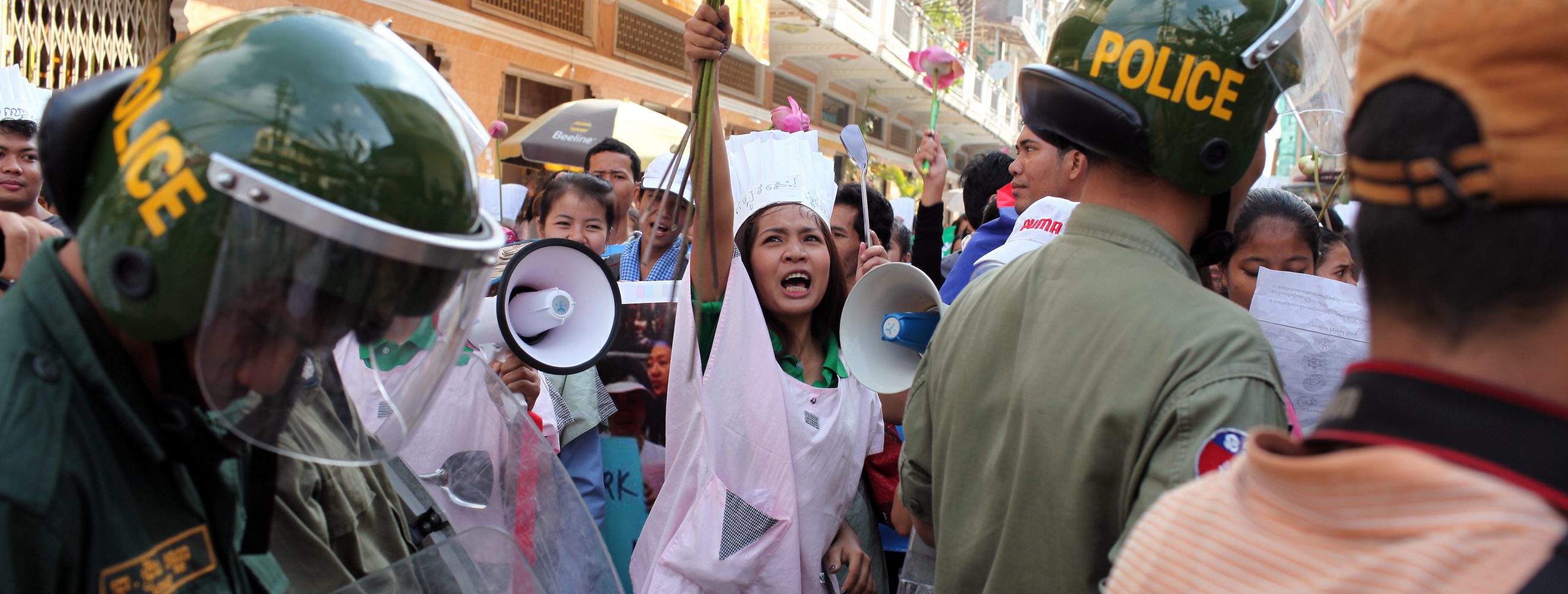 Woman holding flowers in protest