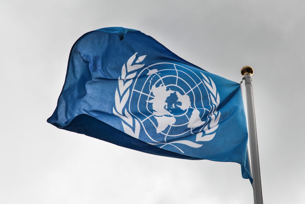 UN flag against grey sky