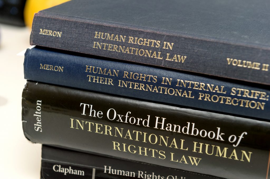 PARIS, FRANCE - NOV 27, 2016: Stack of diverse Human Rights law books preparation for examination exam pass, mb and phd thesis