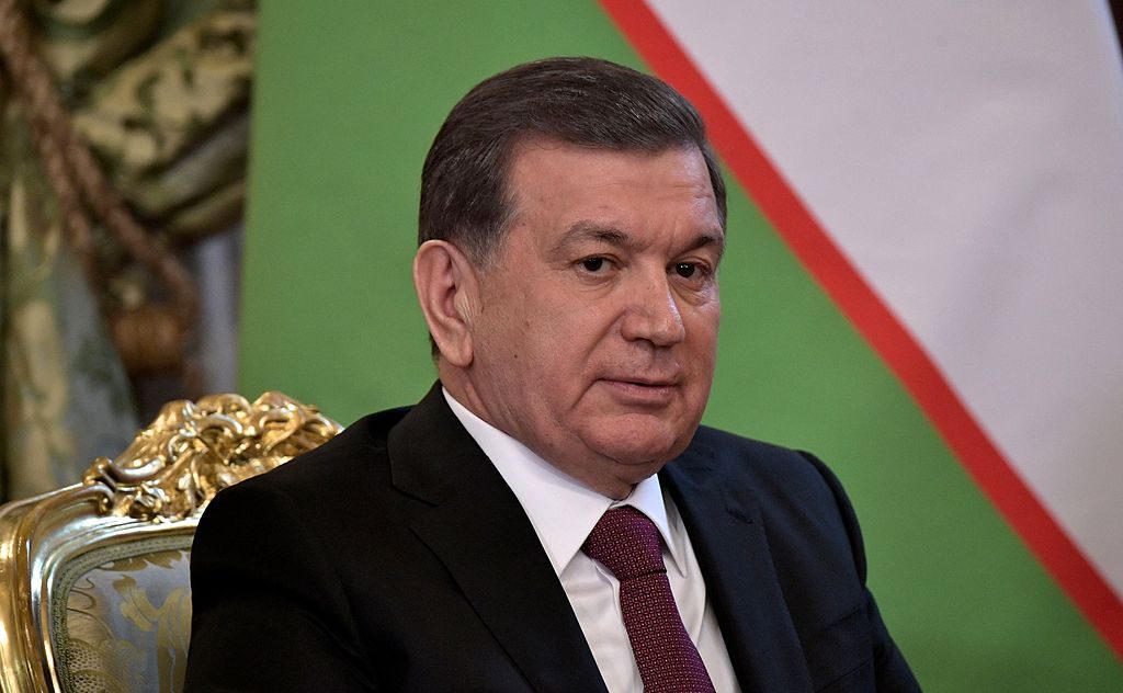 President of Uzbekistan Shavkat Mirziyoev sitting in a chair.