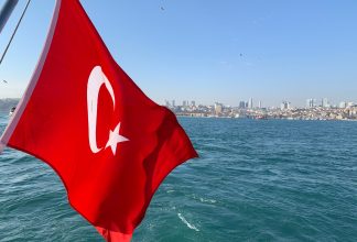 The flag of Turkey from boat overlooking the Bospor and Istanbul