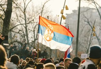 Serbian flag at crowds in Belgrade, Serbia