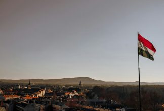 Hungarian flag with landscape in the background